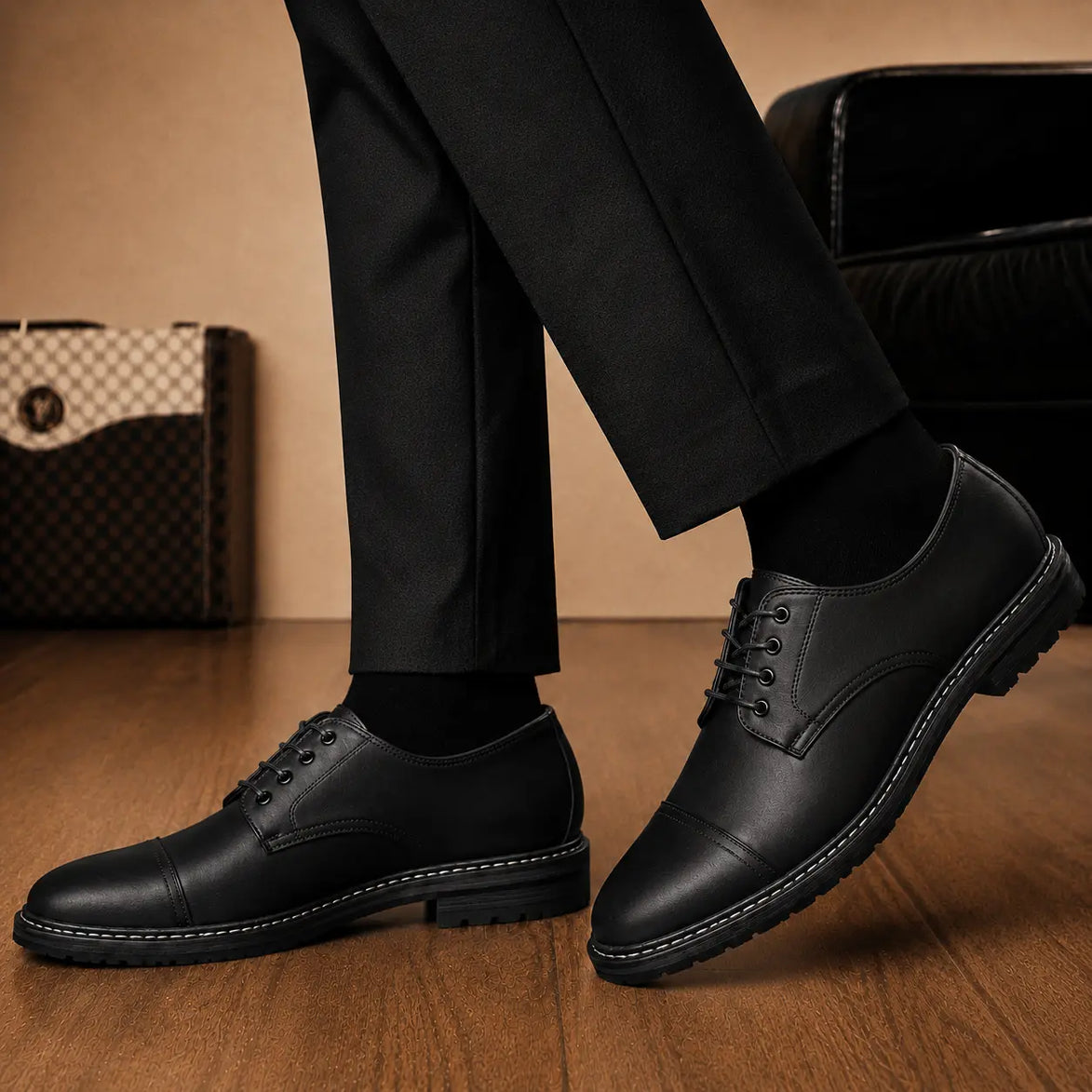 Melodiapelle Max Cap Toe Derby in black leather worn with formal trousers, on-feet shot
