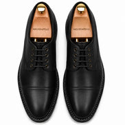 Melodiapelle Max Cap Toe Derby in black leather, pair top-down view, handcrafted in Agra