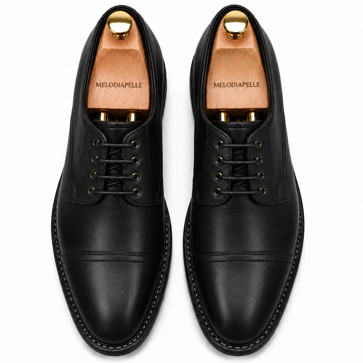 Melodiapelle Max Cap Toe Derby in black leather, pair top-down view, handcrafted in Agra