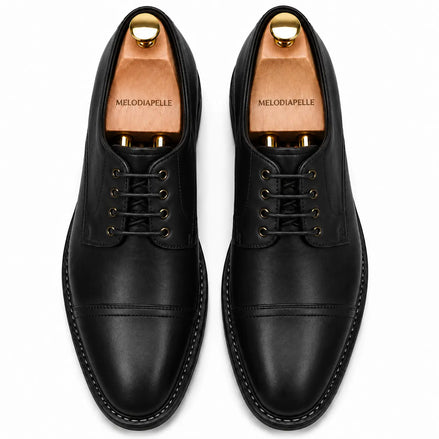 Melodiapelle Max Cap Toe Derby in black leather, pair top-down view, handcrafted in Agra