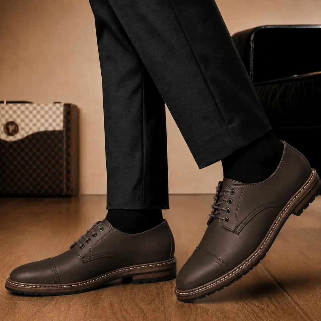 Melodiapelle Max Cap Toe Derby in dark brown leather worn with formal trousers, on-feet shot