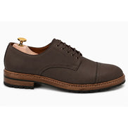 Side profile of the Max Cap Toe Derby in dark brown leather on white background