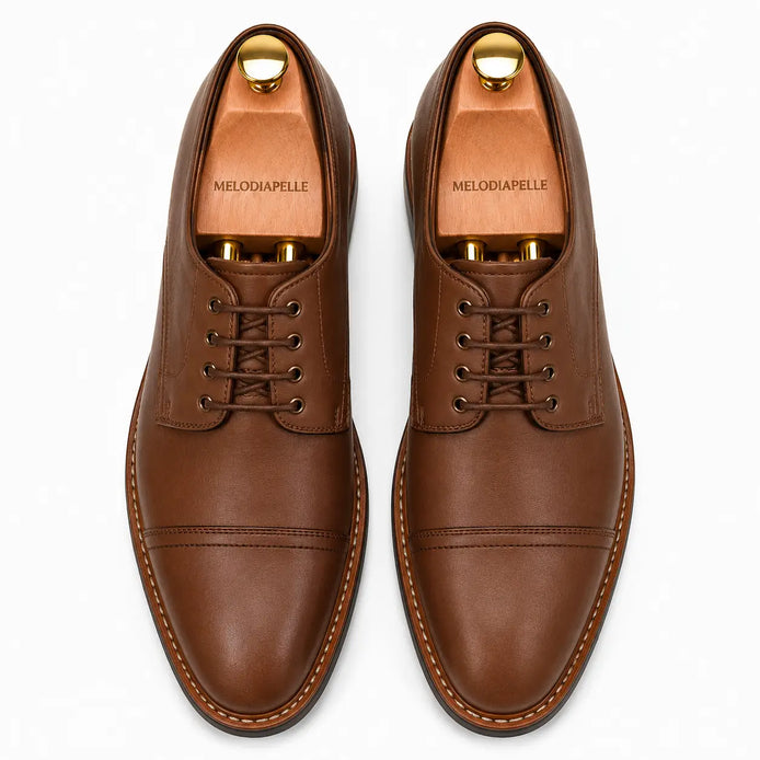 Melodiapelle Max Cap Toe Derby in mole brown nubuck leather, pair top-down view, handcrafted in Agra
