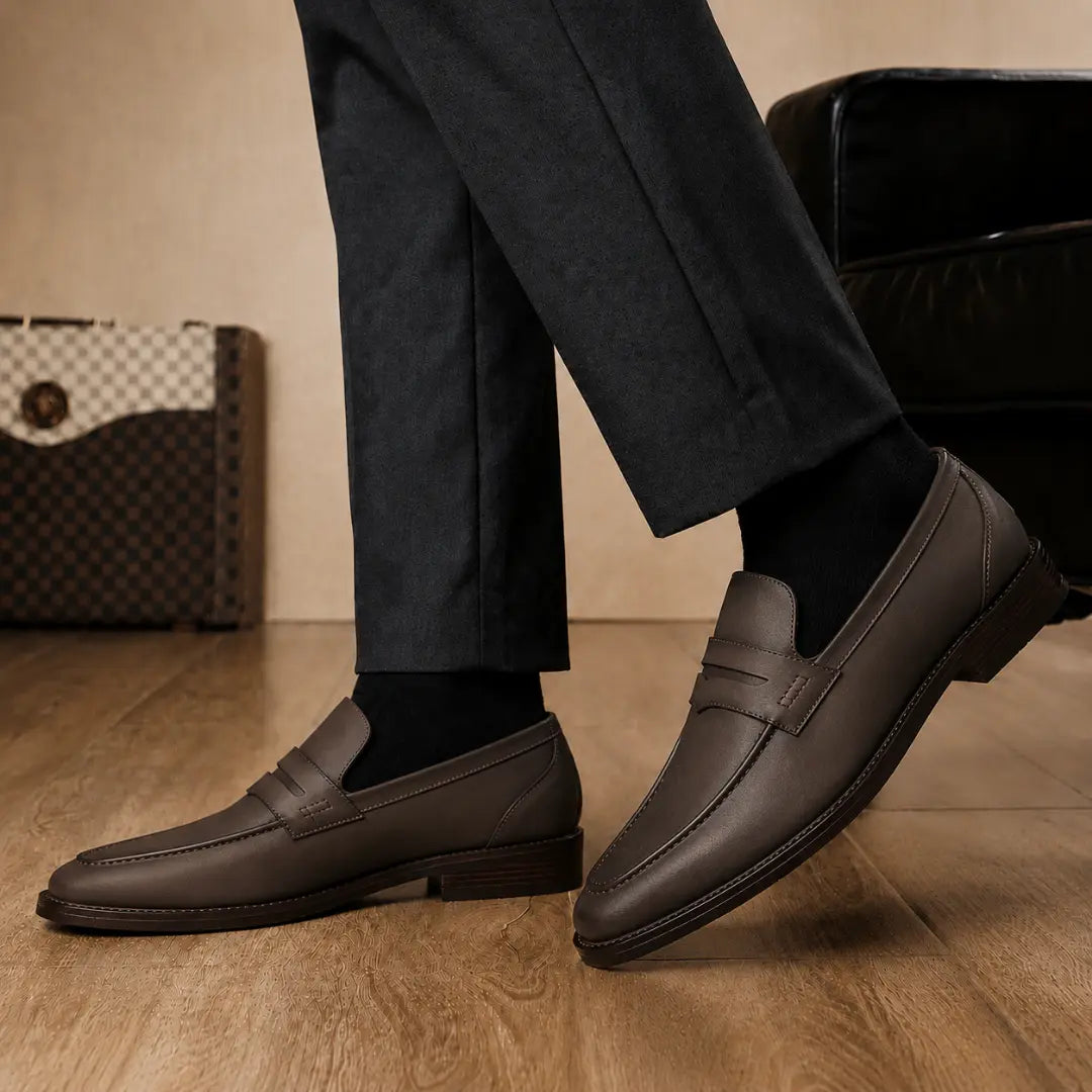 Melodiapelle Maximus Dress Penny Loafer in brown leather worn with formal trousers, on-feet shot