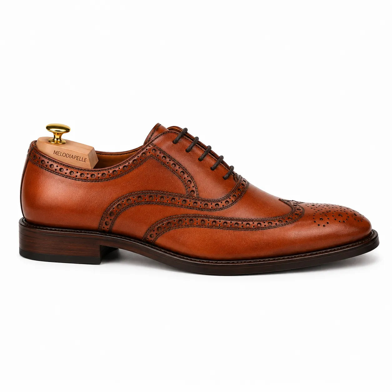 Side profile of the Mazaro Wingtip Brogue Oxford in cognac tan leather on white background