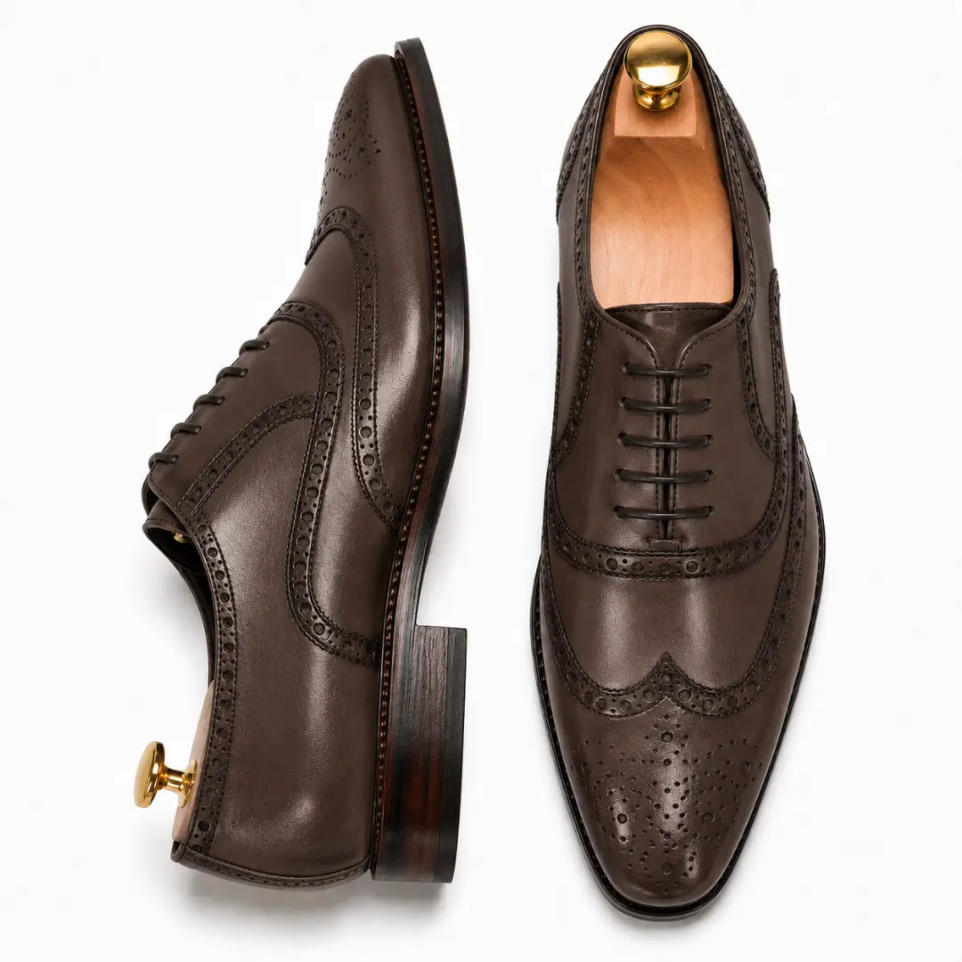 Dark brown leather wingtip brogue Oxford, three-quarter angle showing heel and brogue detailing