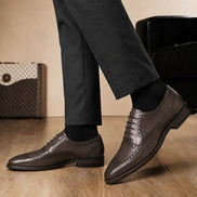 Melodiapelle Mazaro Wingtip Brogue Oxford in dark brown leather worn with formal trousers, on-feet shot