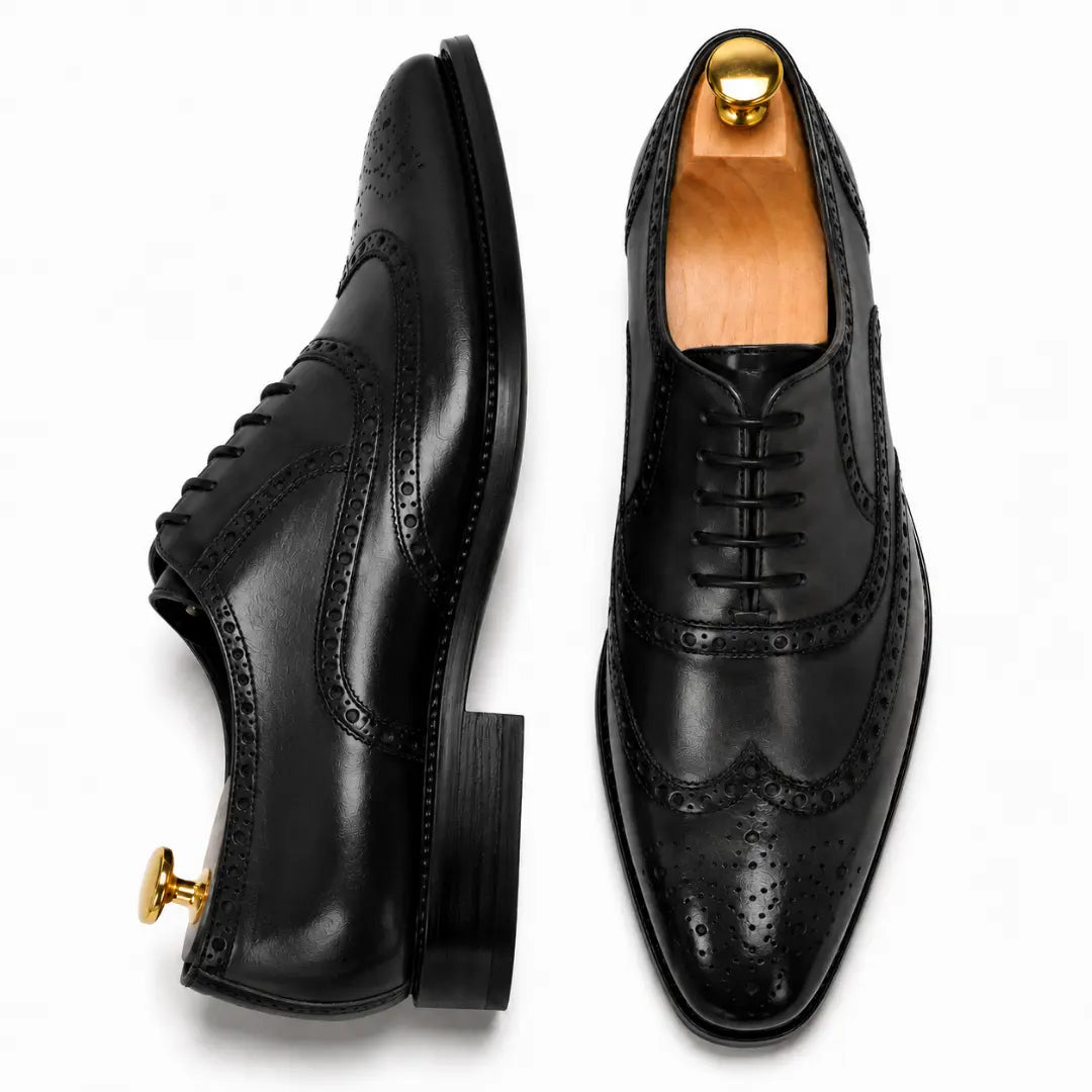 Nero black leather wingtip brogue Oxford, three-quarter angle showing heel and brogue detailing