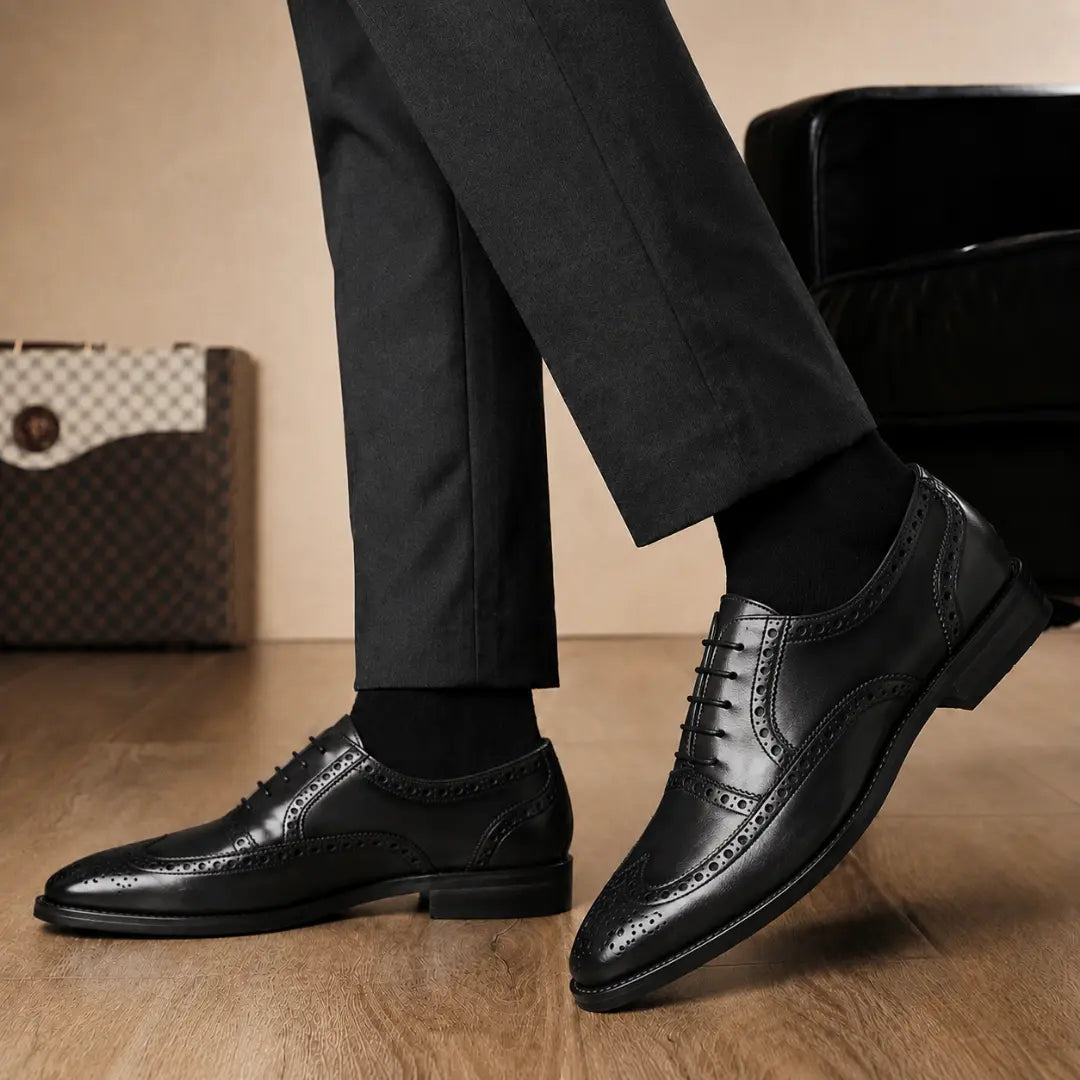 Melodiapelle Mazaro Wingtip Brogue Oxford in nero black leather worn with formal trousers, on-feet shot