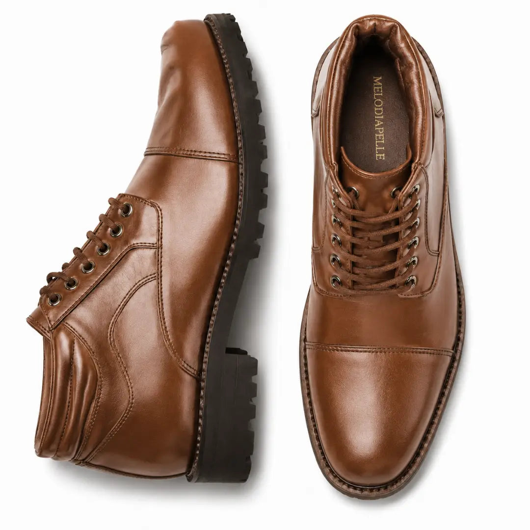 Tan leather cap-toe combat boot, three-quarter angle showing heel and sole detailing