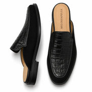 Black croc-embossed leather penny mule, three-quarter angle showing heel and texture detailing