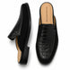 Black croc-embossed leather penny mule, three-quarter angle showing heel and texture detailing