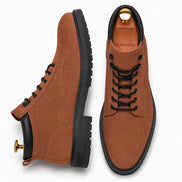 Rust tan leather combat boot, three-quarter angle showing heel and sole detailing