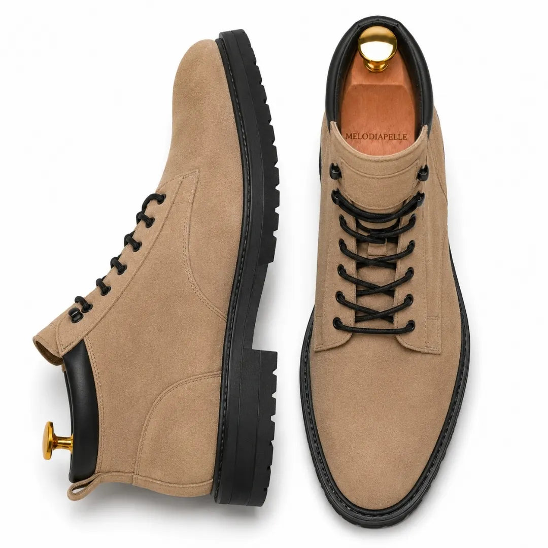 Sand beige suede combat boot, three-quarter angle showing heel and sole detailing