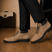 Melodiapelle Meilbourne Combat Boot in sand beige suede worn with trousers, on-feet shot