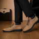 Melodiapelle Meilbourne Combat Boot in sand beige suede worn with trousers, on-feet shot
