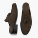 Black suede tassel mule, three-quarter angle showing tassel and heel