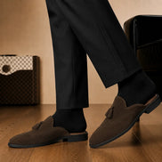 Melodiapelle Mendiai Mule in dark brown suede worn with trousers, on-feet shot