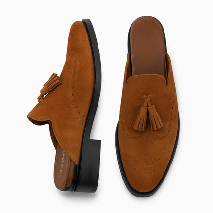 Rust tan suede tassel mule, three-quarter angle showing tassel and heel