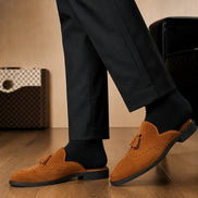 Melodiapelle Mendiai Mule in rust tan suede worn with trousers, on-feet shot