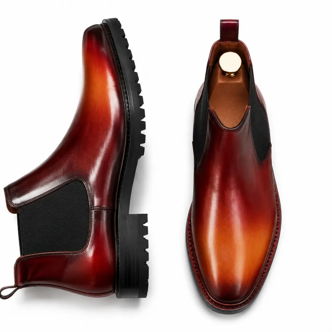 Burnt ombre leather Chelsea boot, three-quarter angle showing heel and sole detailing