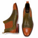 Olive and tan leather Chelsea boot, three-quarter angle showing floral embossing and heel detailing