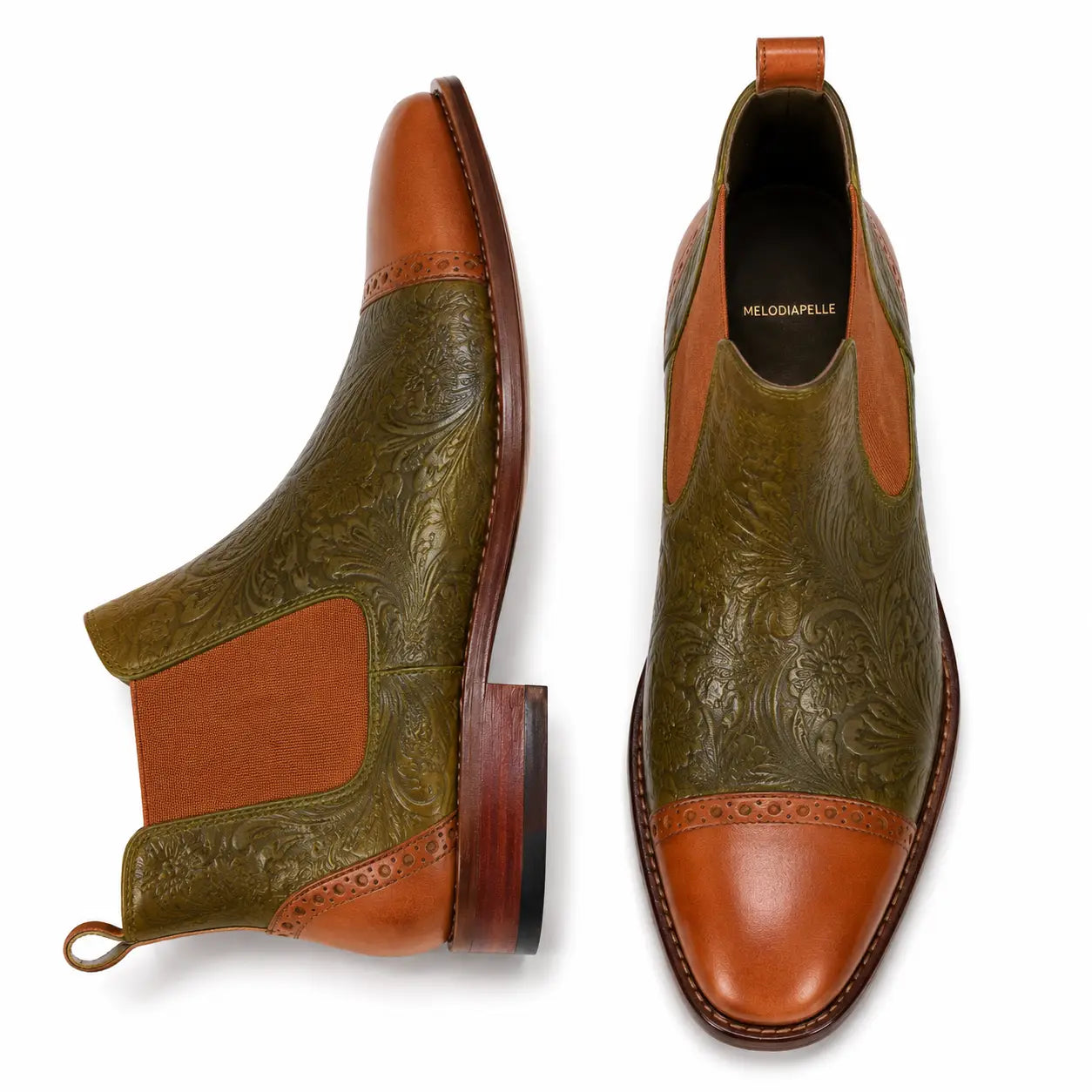 Olive and tan leather Chelsea boot, three-quarter angle showing floral embossing and heel detailing