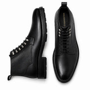 Black leather combat boot, three-quarter angle showing heel and sole detailing