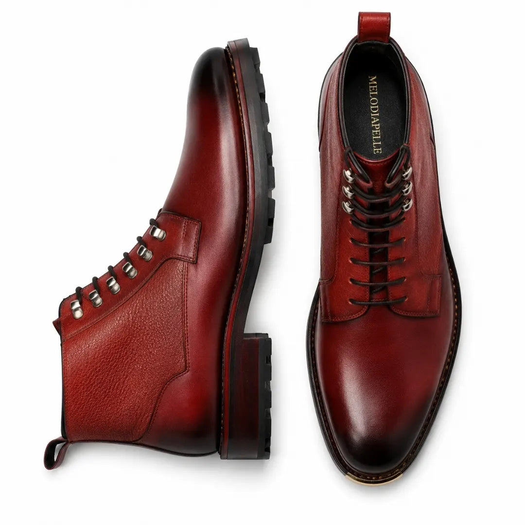 Burgundy red leather combat boot, three-quarter angle showing heel and sole detailing