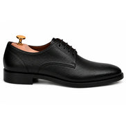 Side profile of the Meridian Derby Shoes in black leather on white background