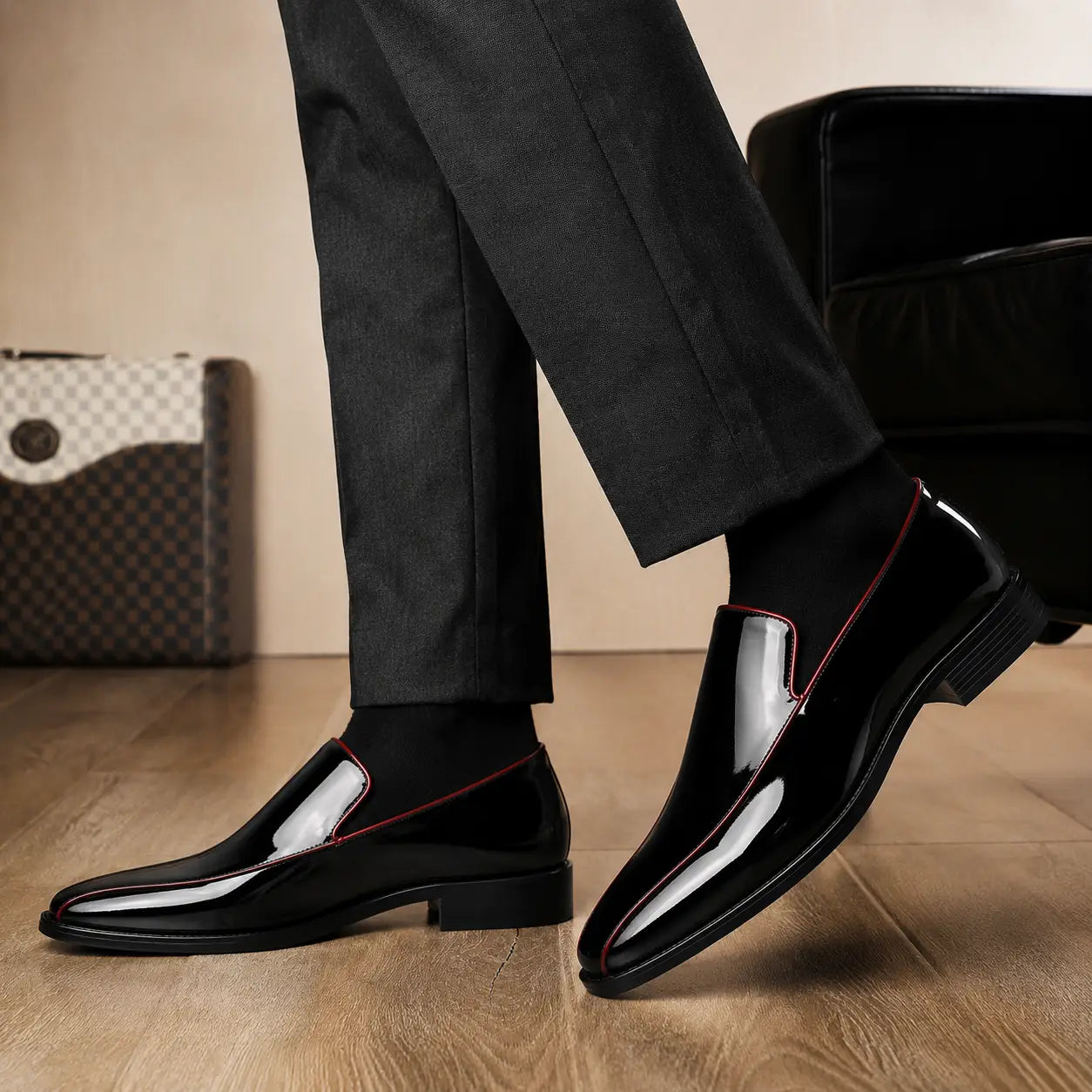 Melodiapelle Merlot Dress Loafer in nero black leather with red piping worn with formal trousers, on-feet shot