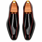 Melodiapelle Merlot Dress Loafer in nero black leather with red piping, pair top-down view, handcrafted in Agra