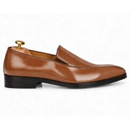 Side profile of the Merlot Dress Loafer in tan leather on white background