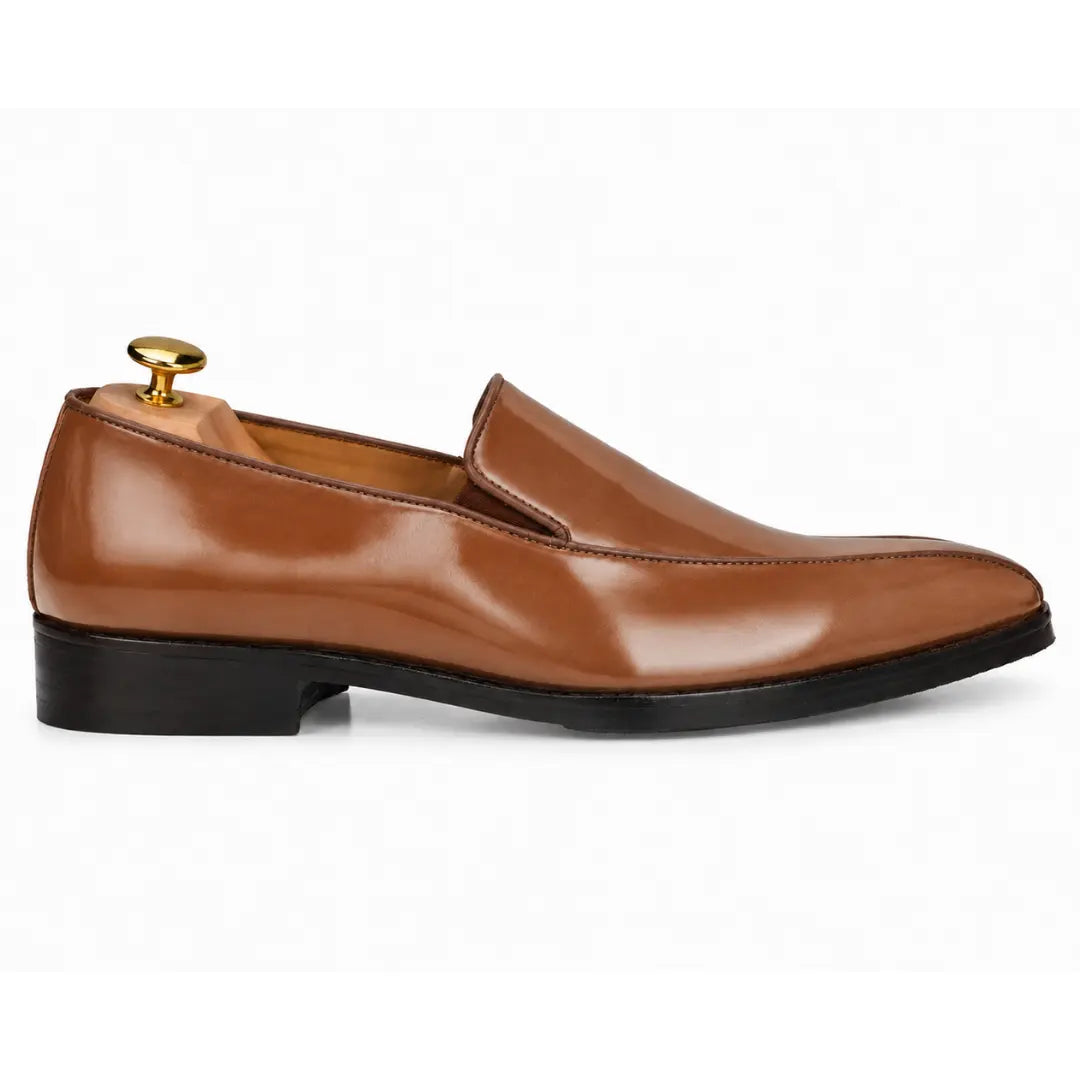 Side profile of the Merlot Dress Loafer in tan leather on white background