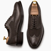 Dark brown leather semi-brogue Oxford, three-quarter angle showing heel and brogue detailing