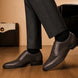 Melodiapelle Meta Semi-Brogue Oxford in dark brown leather worn with formal trousers, on-feet shot