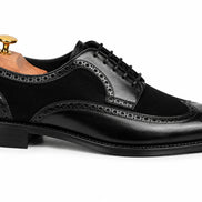 Side profile of the Meta Semi-Brogue Oxford in nero black leather on white background