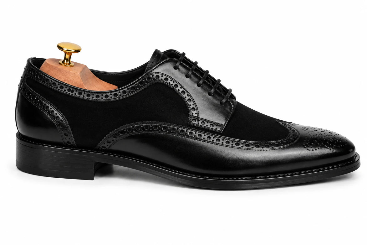 Side profile of the Meta Semi-Brogue Oxford in nero black leather on white background