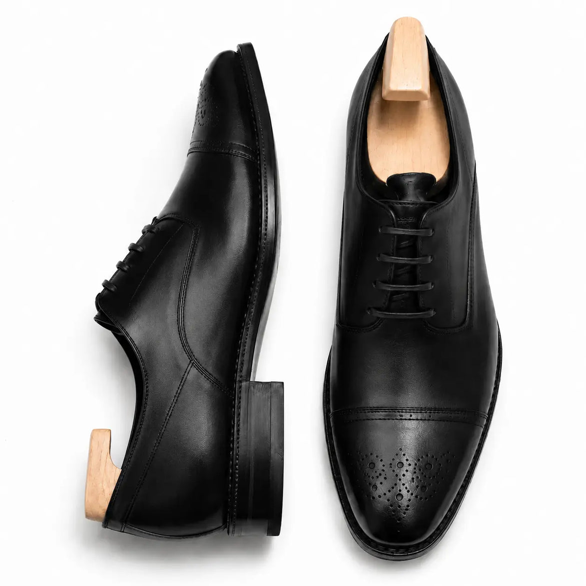 Black leather wholecut Oxford, three-quarter angle showing heel and toe detailing