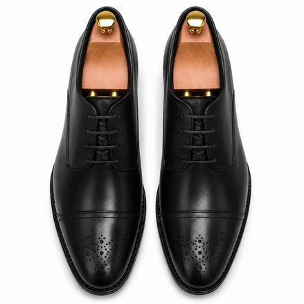 Melodiapelle Meta Wholecut Oxford in black leather, pair top-down view, handcrafted in Agra