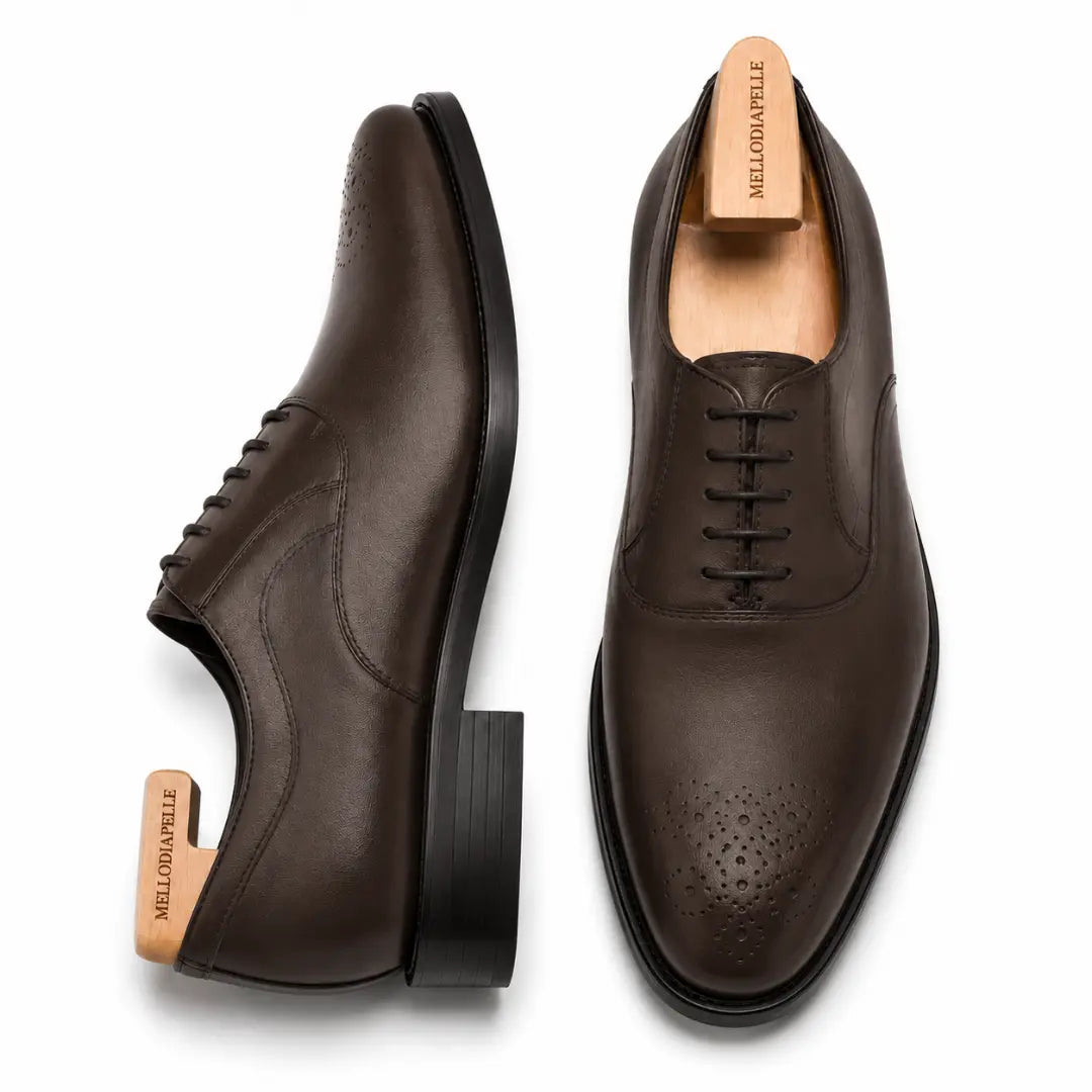 Brown leather wholecut Oxford, three-quarter angle showing seamless upper and heel