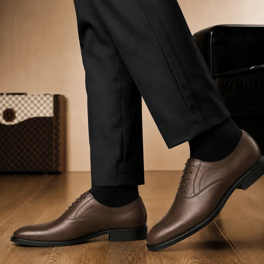 Melodiapelle Meta Wholecut Oxford in brown leather worn with formal trousers, on-feet shot
