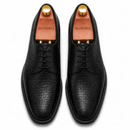 Melodiapelle Meta Wholecut Oxford in black croc-embossed leather, pair top-down view, handcrafted in Agra