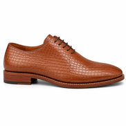 Side profile of the Meta Wholecut Oxford in tan croc-embossed leather on white background
