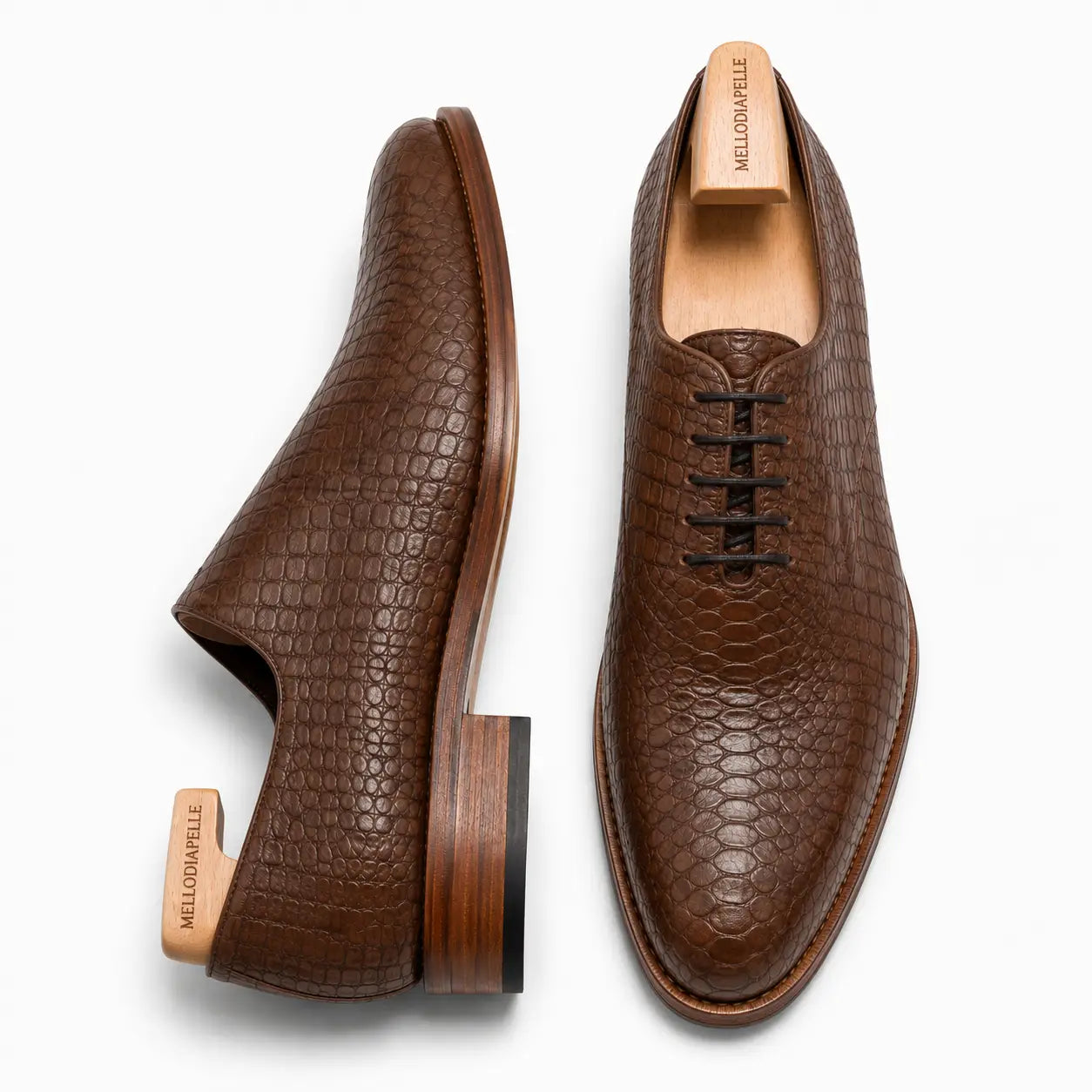 Taupe brown croc-embossed leather wholecut Oxford, three-quarter angle showing heel and texture detailing