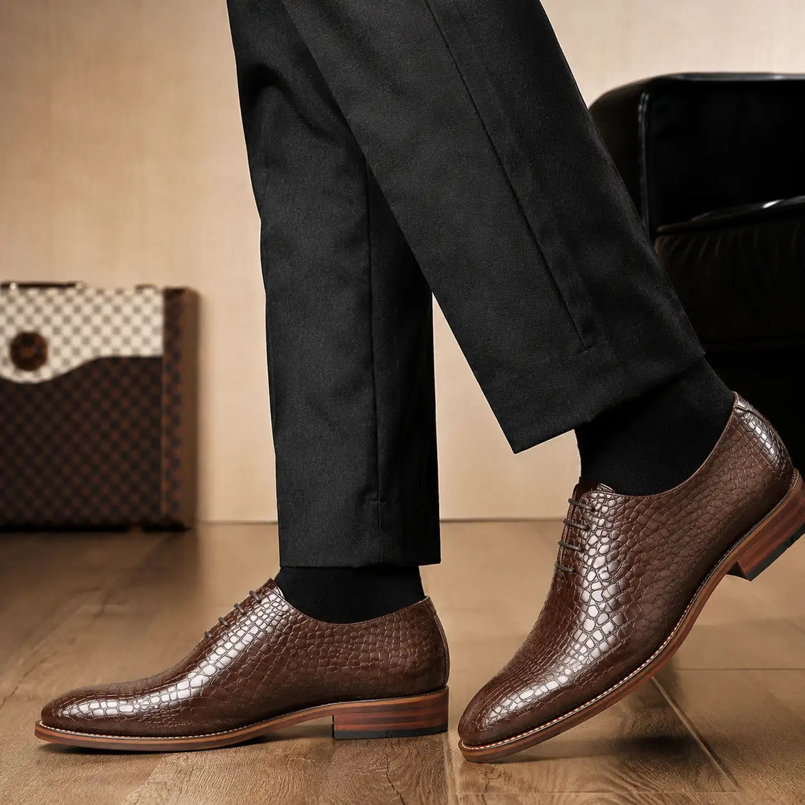 Melodiapelle Meta Wholecut Oxford in taupe brown croc-embossed leather worn with formal trousers, on-feet shot