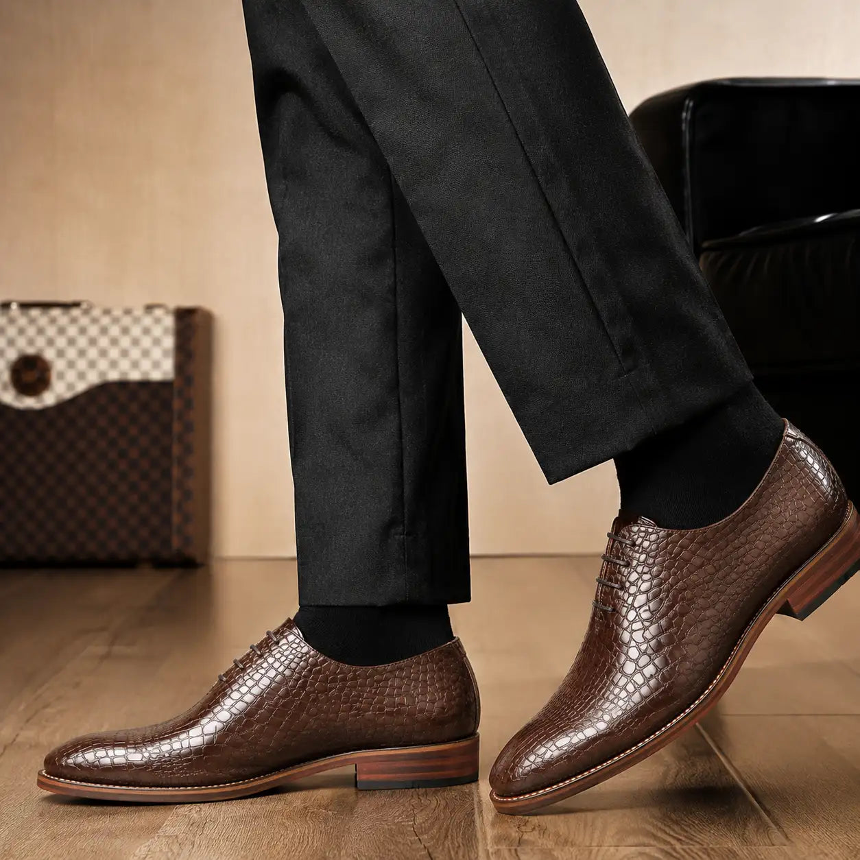 Melodiapelle Meta Wholecut Oxford in taupe brown croc-embossed leather worn with formal trousers, on-feet shot