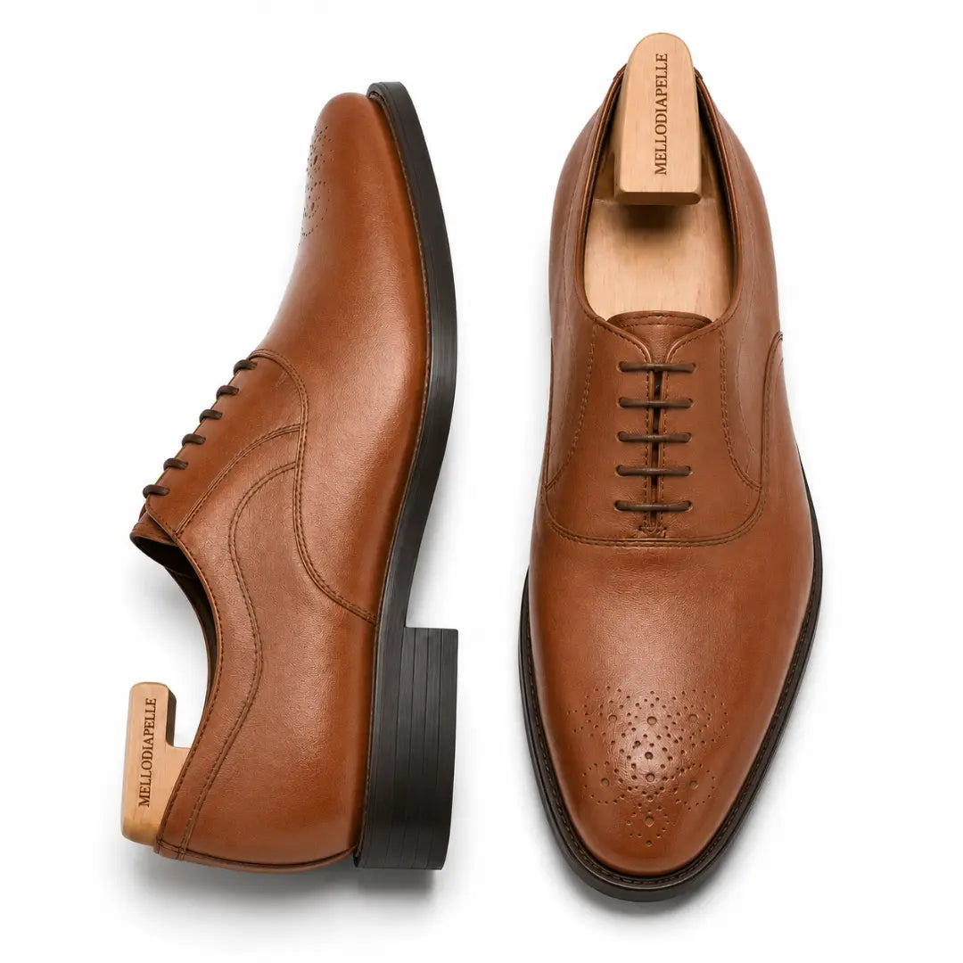 Tan leather wholecut Oxford, three-quarter angle showing seamless upper and heel