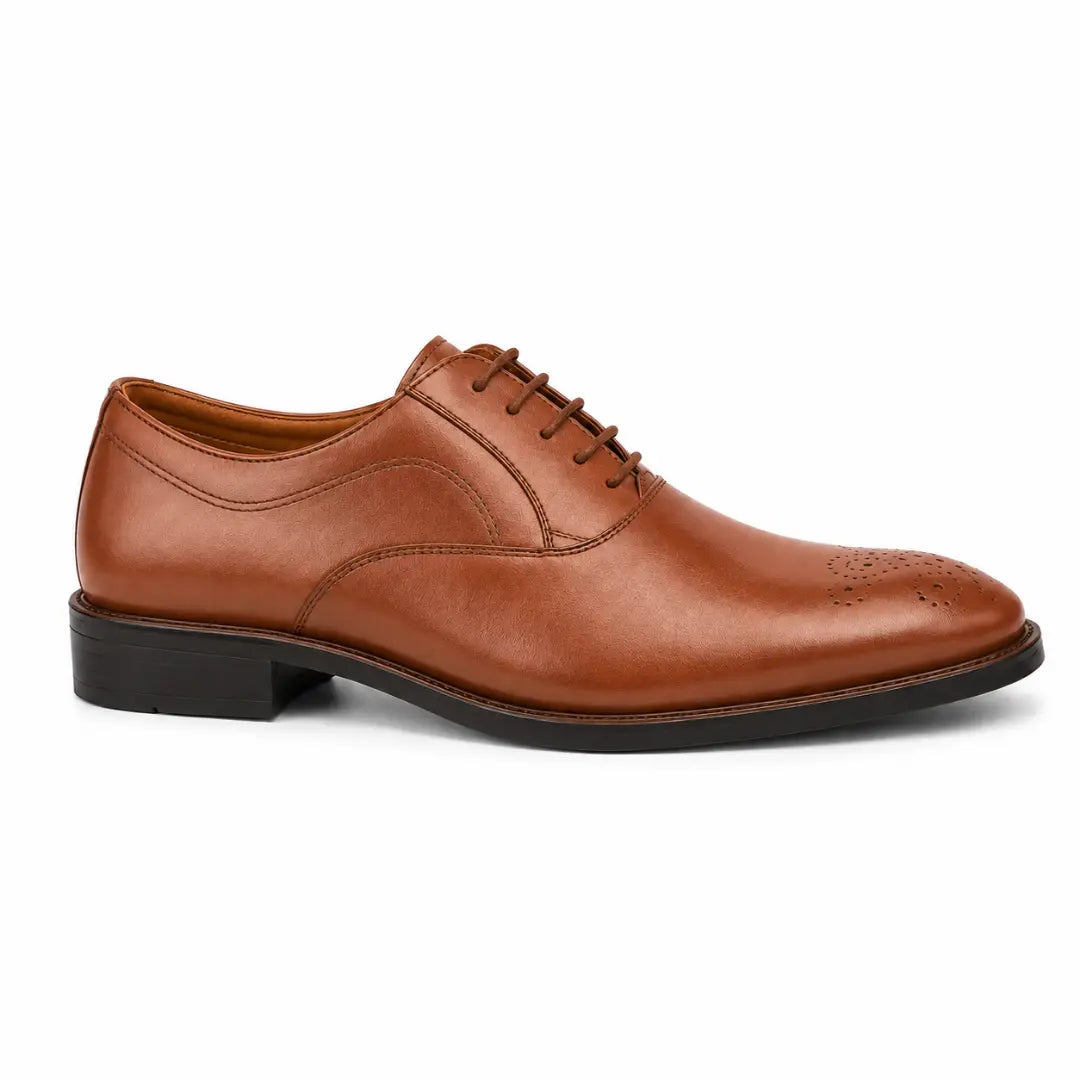 Side profile of the Meta Wholecut Oxford in tan leather on white background