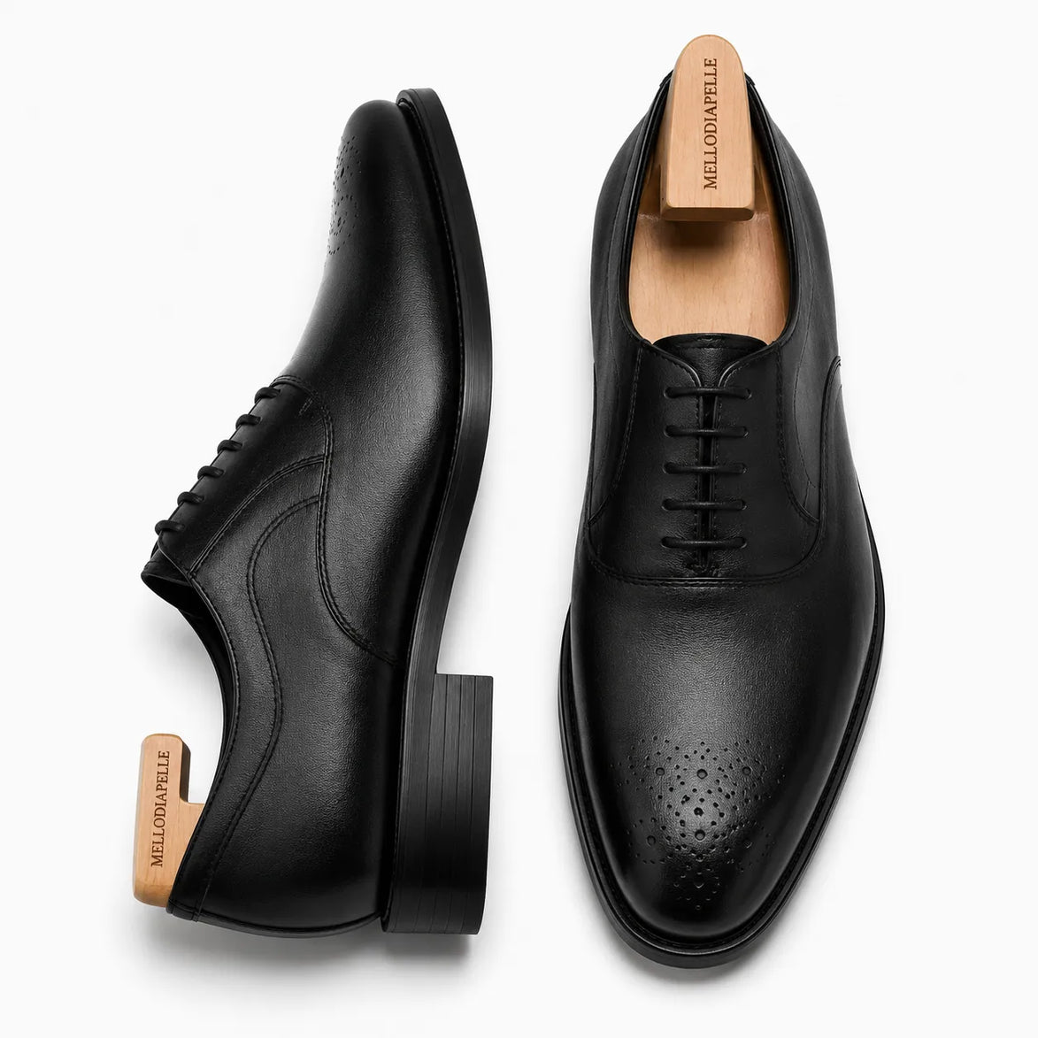 Nero black leather wholecut Oxford, three-quarter angle showing seamless upper and heel